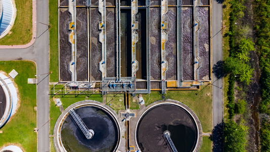 Drainage treatment facility with water management basins