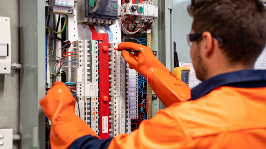 Electrical engineer inspecting an electrical control panel