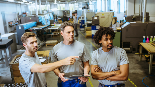 Engineering staff evaluating production line operations