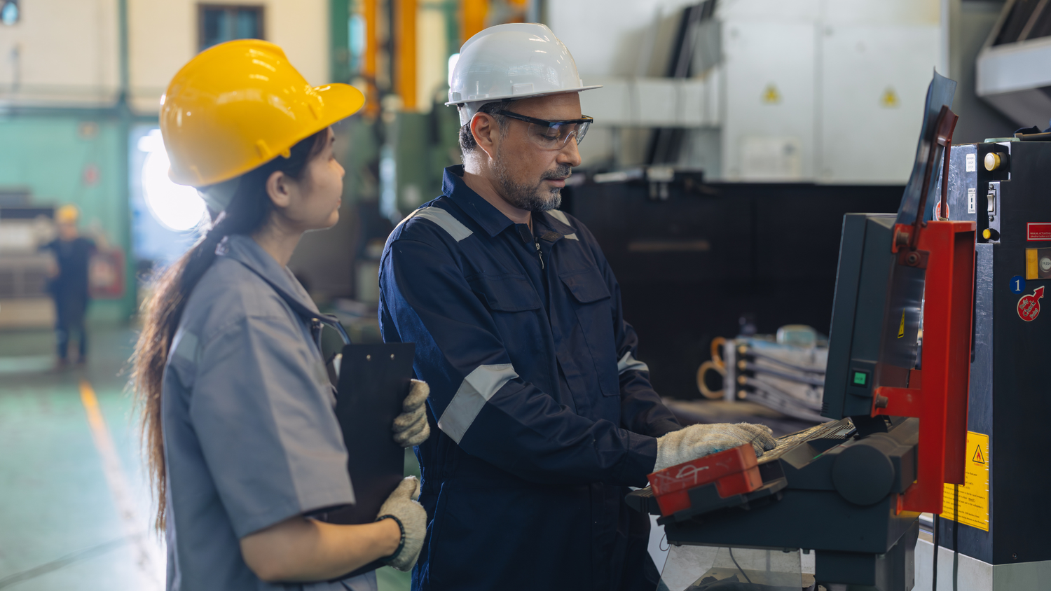 Engineers operating machinery during industrial training session
