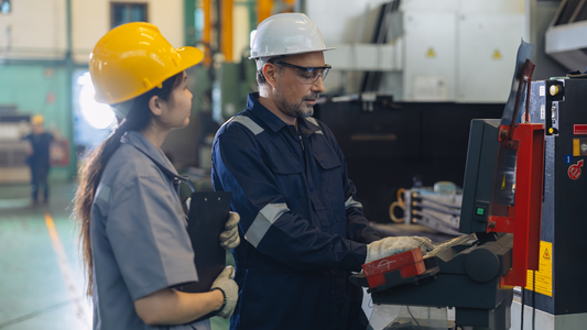 Engineers operating machinery during industrial training session