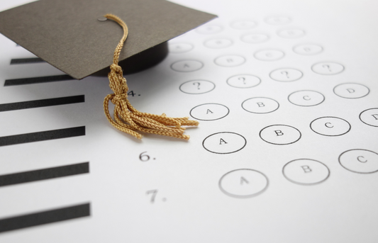 FE exam multiple-choice answer sheet and graduation cap