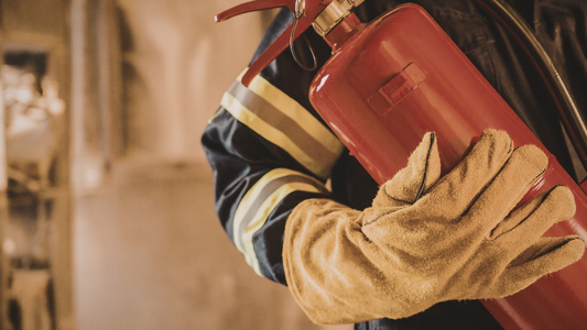 Fire protection engineer holding a fire extinguisher.