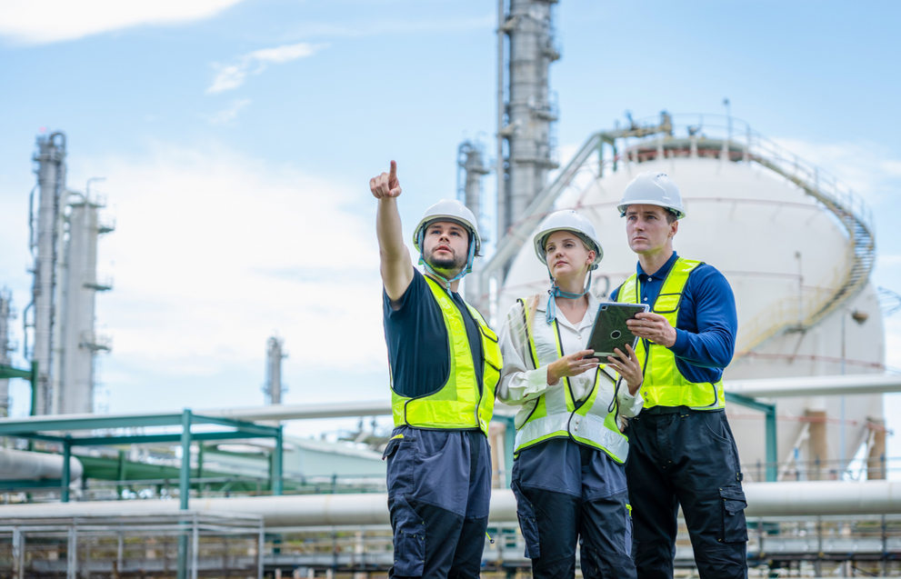 Petroleum engineers at an industrial refinery site