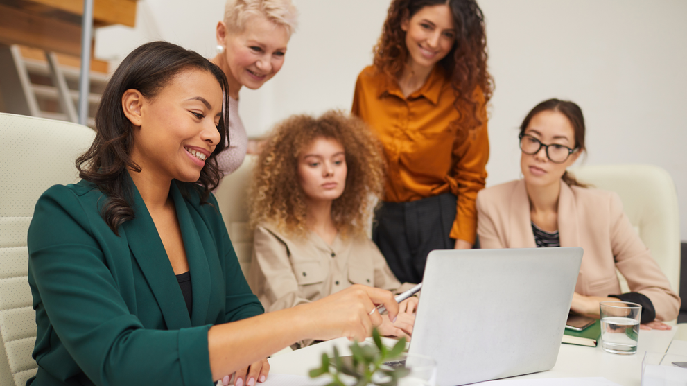 Professionals collaborating on project management work