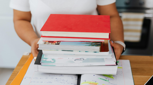 Student holding engineering reference books